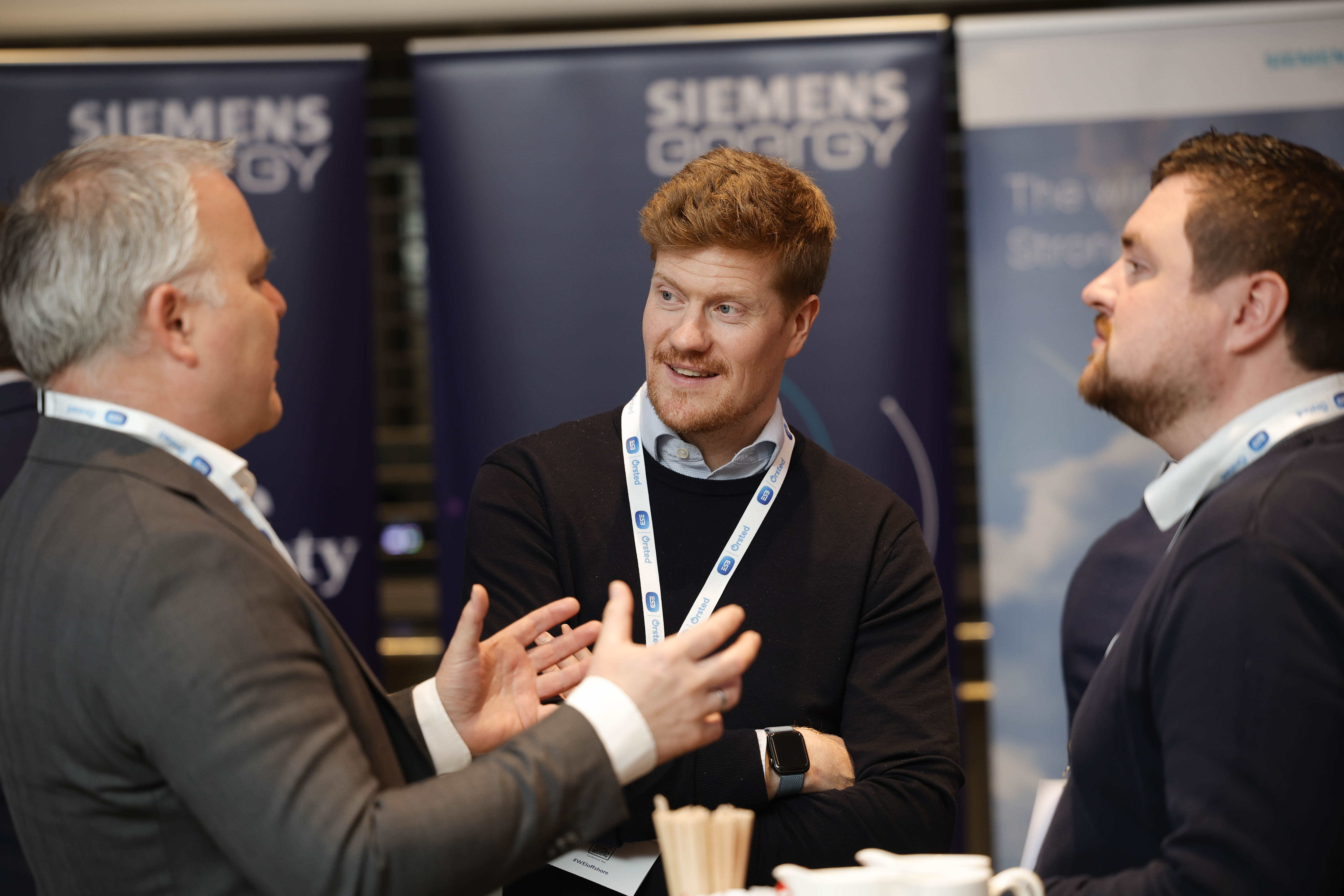 Exhibitors networking at stand
